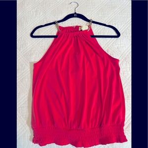 Michael Kors dressy Top with gold chain on shoulders.